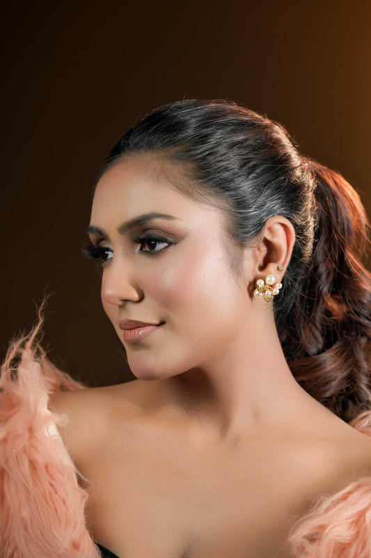 Sparkling golden pearl studs